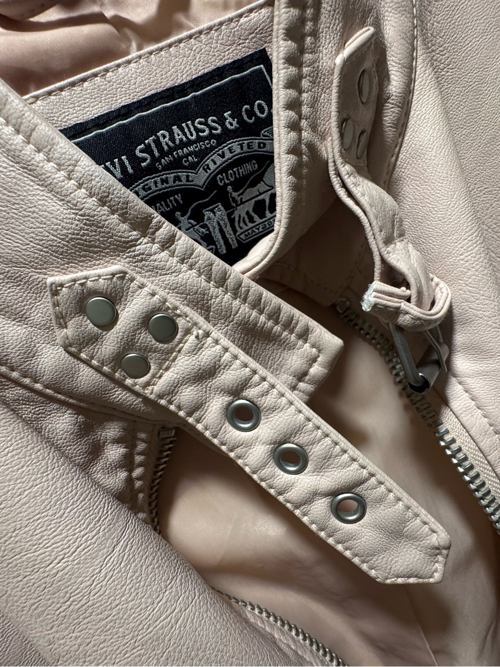 Levi's Light Pink Faux Leather jacket. 

Texture is butter, like real leather.